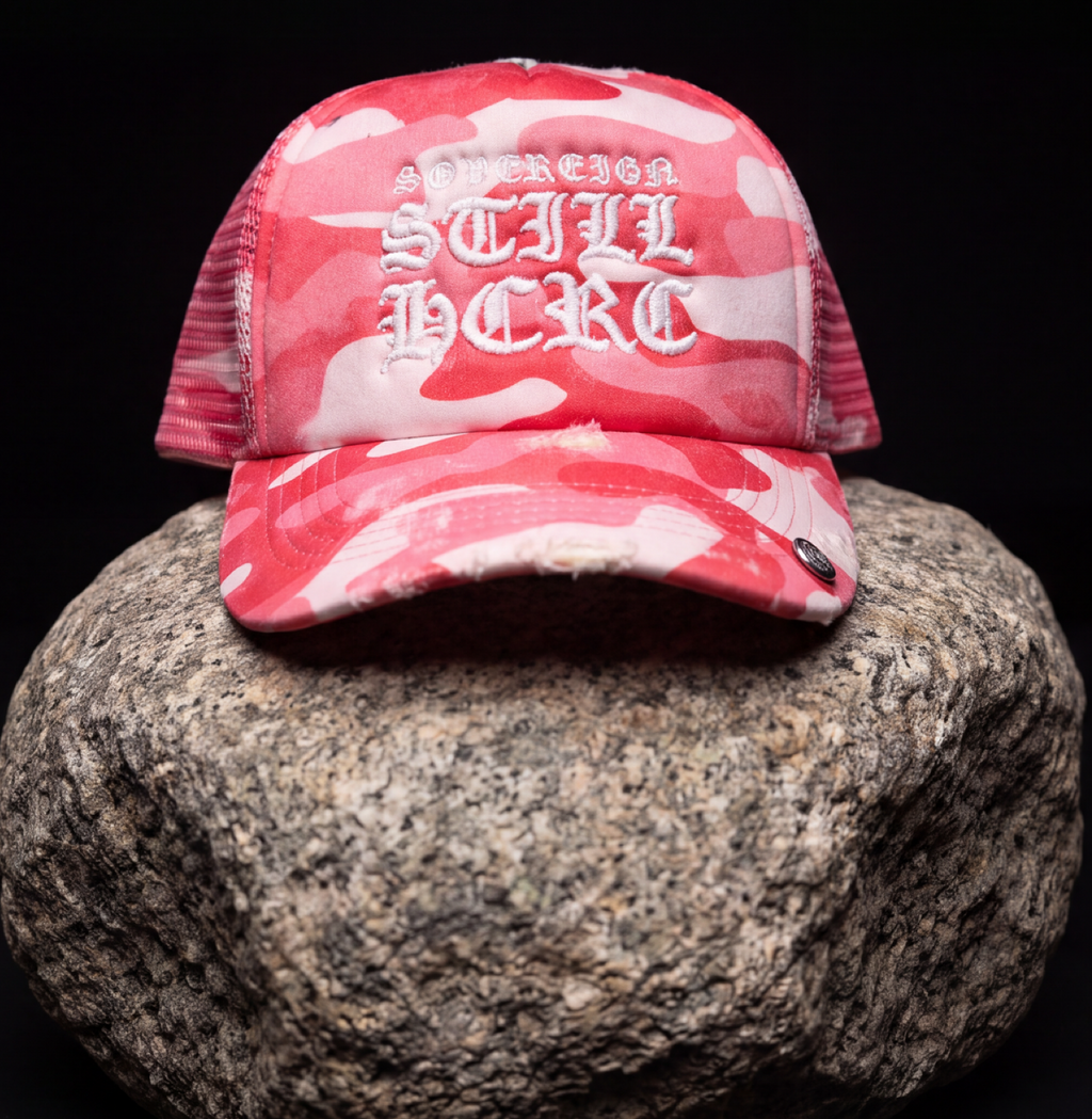 STILL HERE CAMO TRUCKER — DISTRESSED PINK