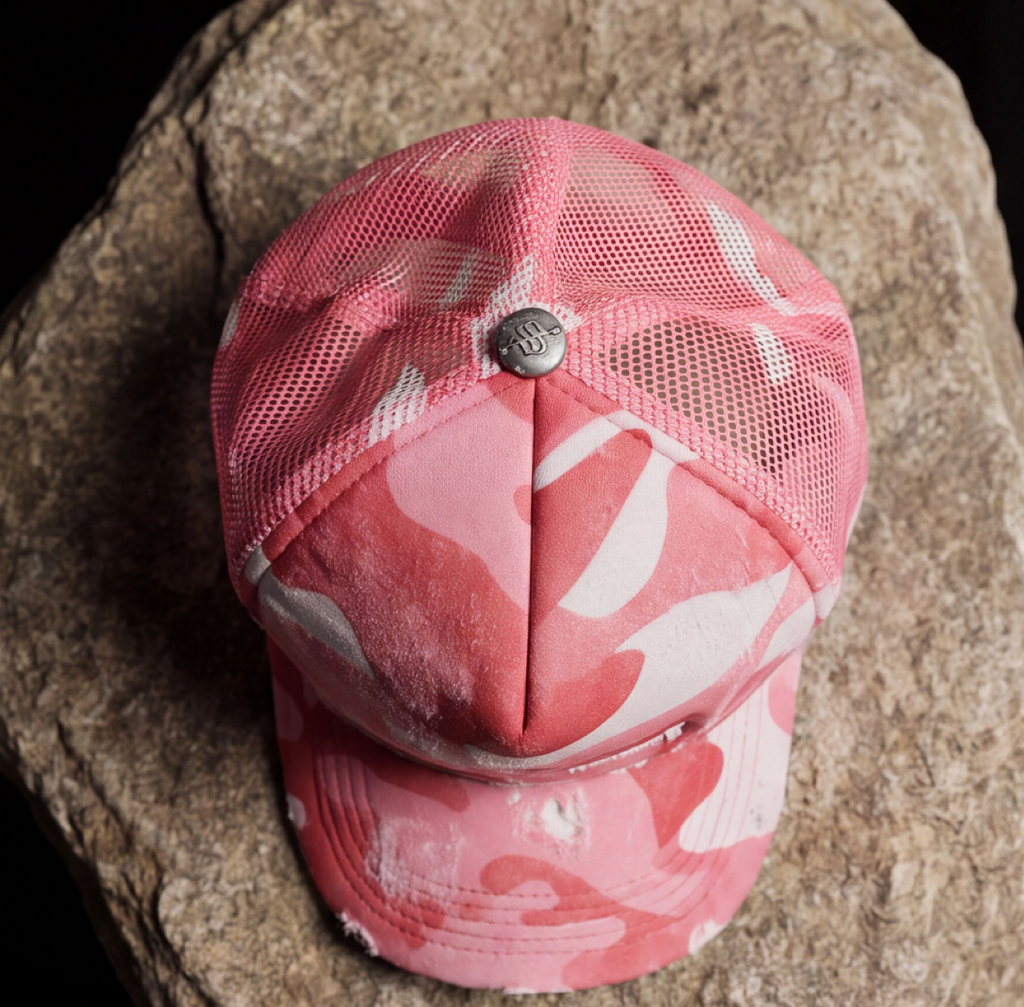 STILL HERE CAMO TRUCKER — DISTRESSED PINK
