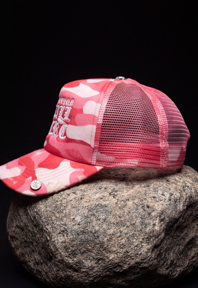 STILL HERE CAMO TRUCKER — DISTRESSED PINK